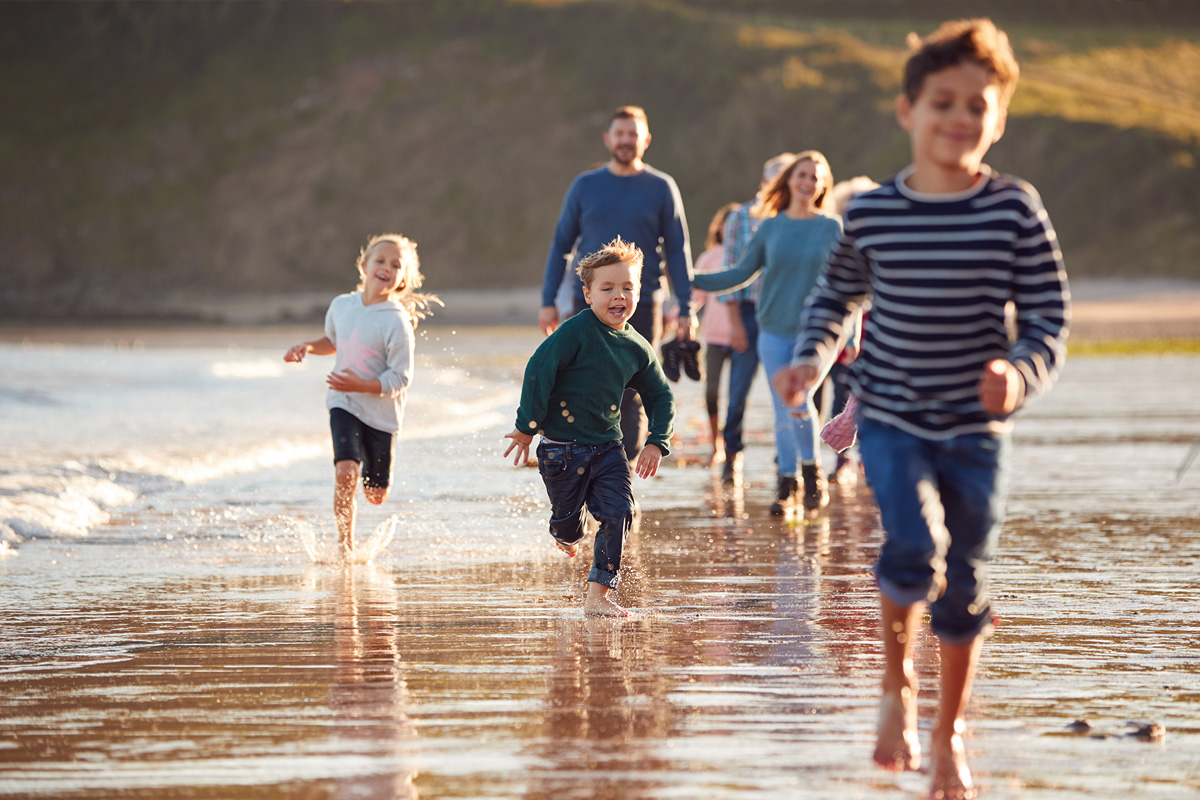 children running on the beach